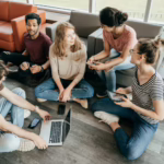Community Success seen with a group of people discussing enthusiastically